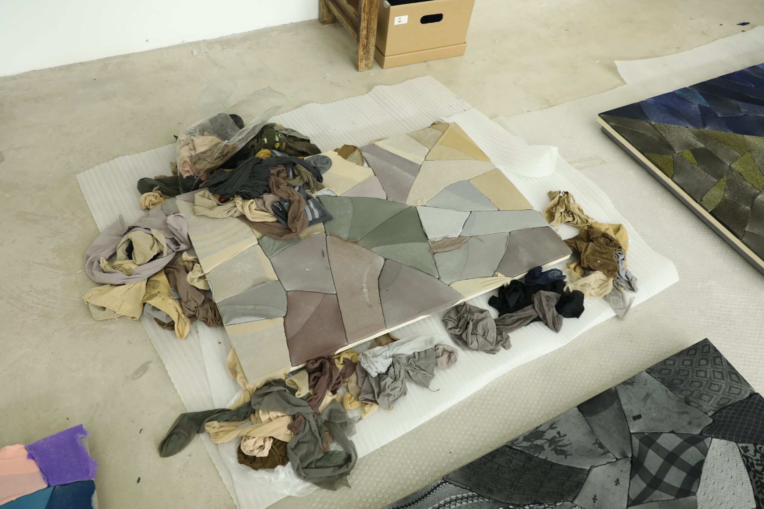 Assorted nylon stockings and a work in progress in Ma Qiusha's studio. Photo commissioned by the Smart Museum of Art during an artist interview. Photo by Yaya Rotem.