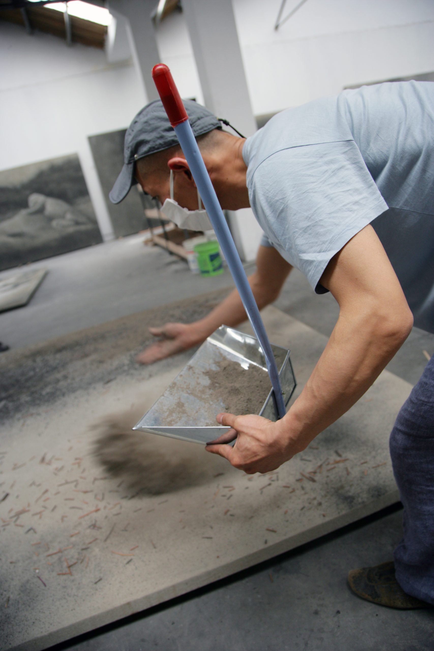 Zhang Huan applying ash to a painting. Photo courtesy of the artist and Pace Gallery.